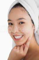 Woman wearing a towel while smiling