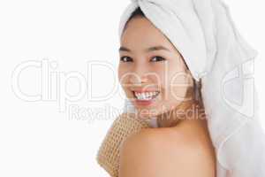 Cheerful woman wearing a towel