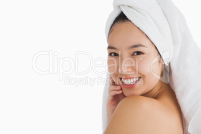 Woman with towel touching her skin