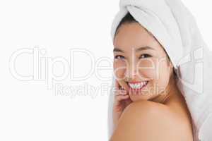 Woman with towel touching her skin