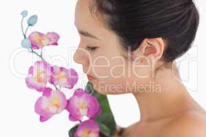 Woman smelling on orchids