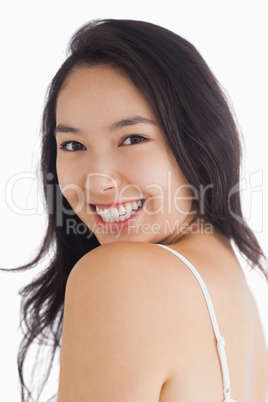 Woman smiling while looking natural