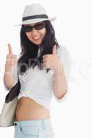 Smiling woman giving thumbs up