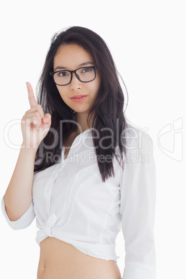 Woman in glasses pointing up