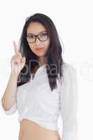 Woman in glasses pointing up