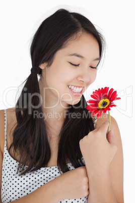 Woman in pigtails holding flower
