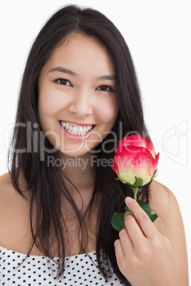 Smiling woman with rose