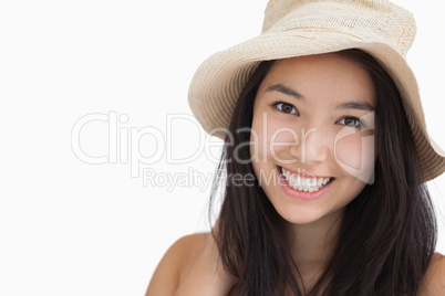 Smiling woman with a straw hat