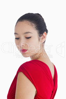 Woman in red dress smiling gently