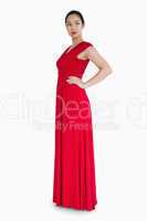 Woman in red dress with her hands on her hips