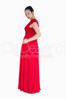 Woman looking at back of red dress