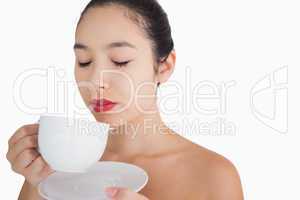Woman smelling the coffee
