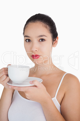 Woman holding a cup of coffee