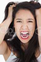 Woman screaming and pulling her hair out