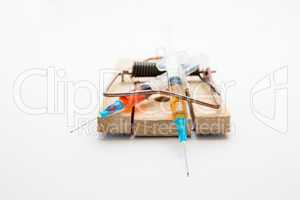 Syringes in a mousetrap