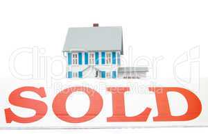 Sold sign in front of house