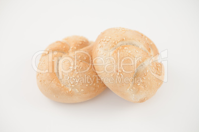 Sesame buns leaning on each other