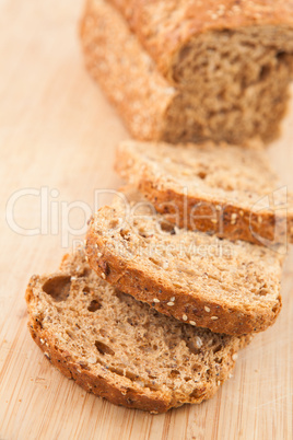 Partially sliced brown bread