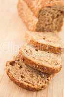 Partially sliced brown bread