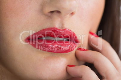 Close-up of woman having red lips