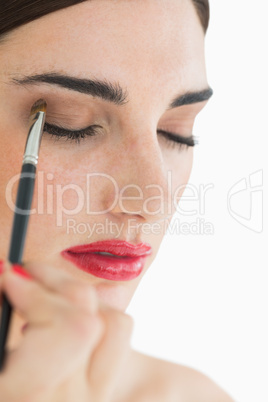 Woman applying makeup