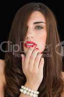 Woman touching her red lips