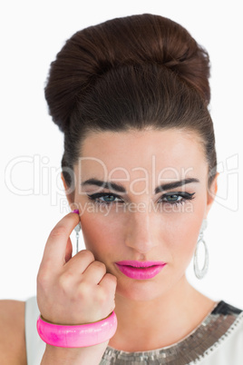 Woman posing with beehive and pink lips