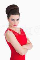 Woman in red dress having arms crossed