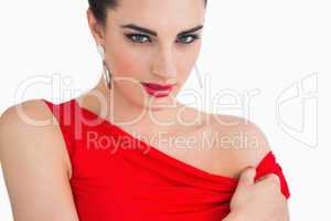 Woman with red dress looking serious