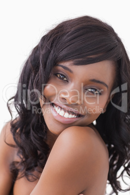 Woman smiling over the shoulder