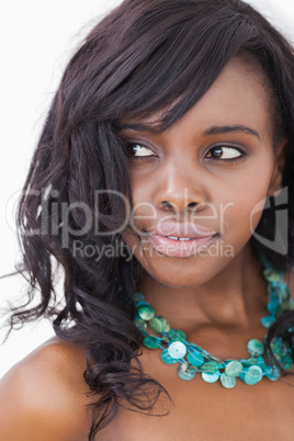 Woman smiling in blue necklace