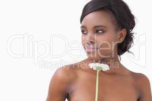 Smiling woman holding flower