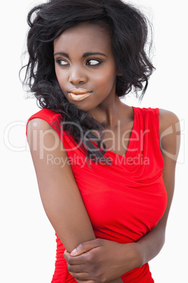 Woman standing while wearing a red dress