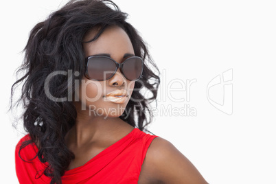 Woman wearing sunglasses and a red dress