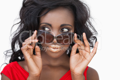 Woman tilting sunglasses