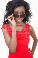 Woman wearing sunglasses with hand on hip