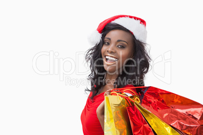 Woman standing while holding bags