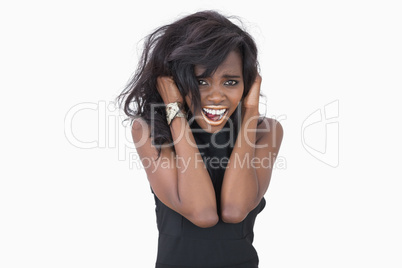 Woman standing hands in hair