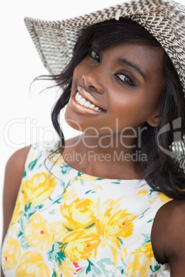 Woman standing wearing a summer hat