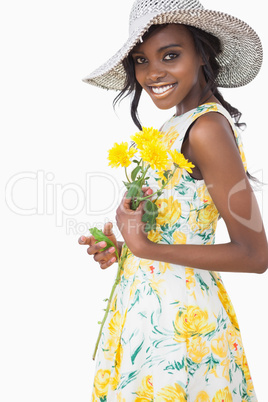 Woman standing holding flowers