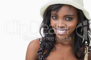 Woman wearing summer hat while smiling