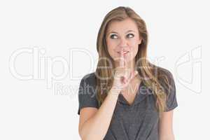 Woman making quiet sign
