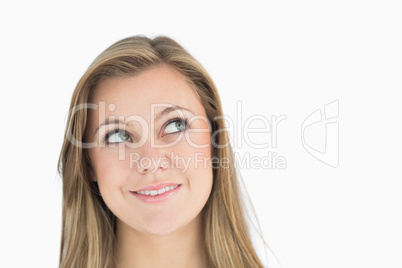 Thoughtful blonde woman smiling