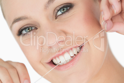 Woman using dental floss