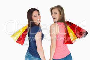 Two happy women with shopping bag