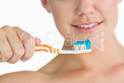 Woman holding the toothbrush