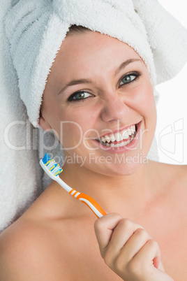 Woman with hair towel smiling