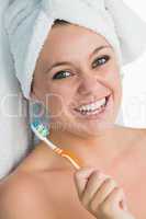 Woman with hair towel smiling