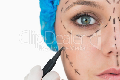 Plastic surgeon marking face