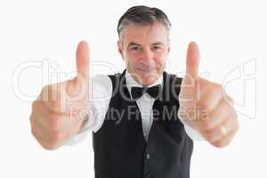 Glad waiter with thumbs up